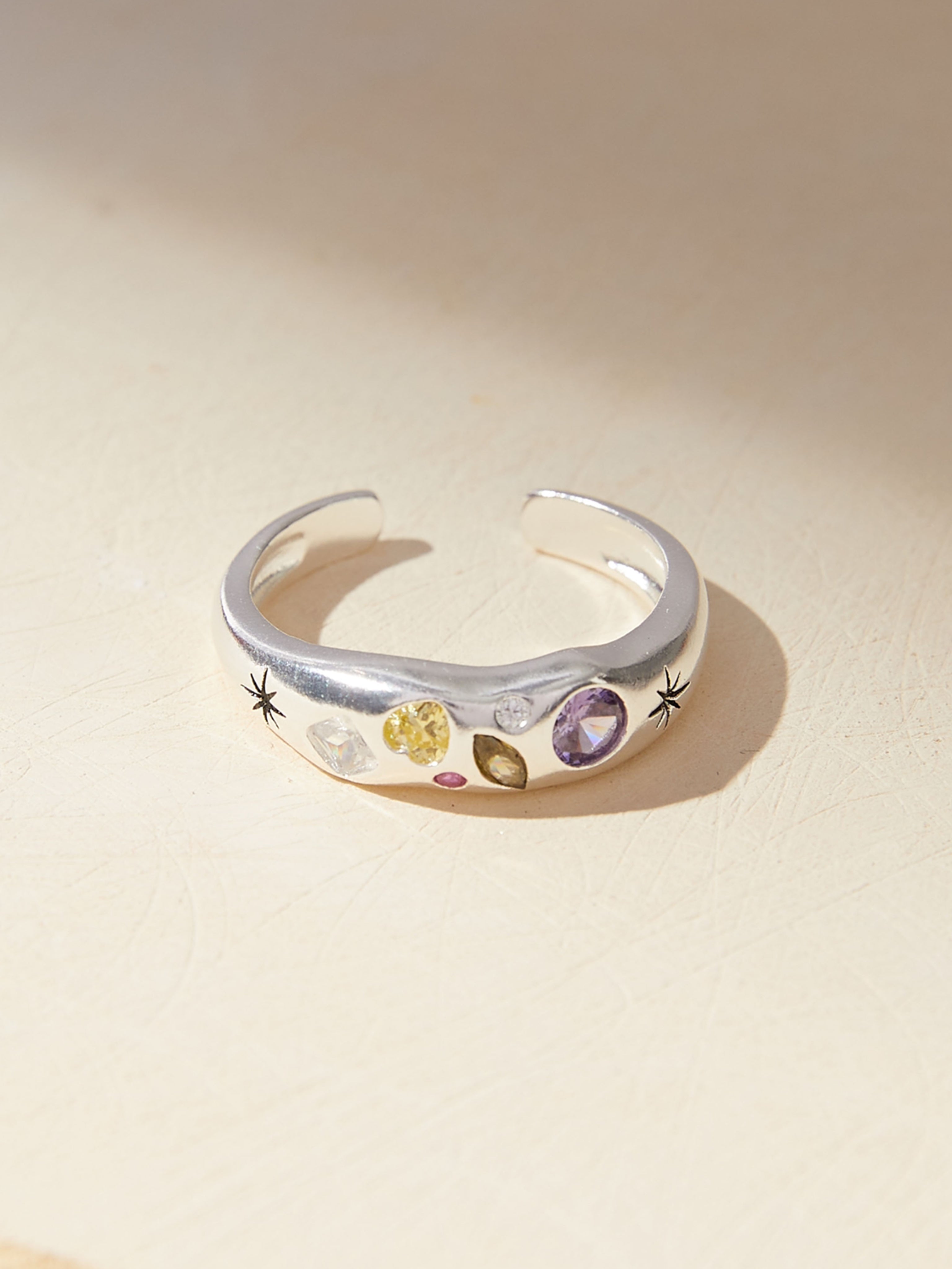 silver zircon ring with purple circle zircon