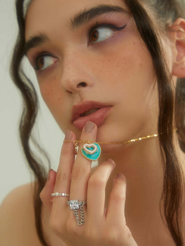 wearing Custom Zora Double-heart Necklace and Liza silver ring
