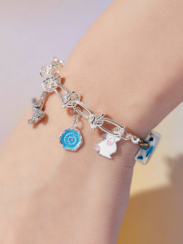 wearing Custom Lucky Charm Initial Bracelet