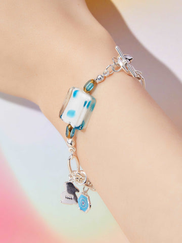 wearing Custom Lucky Charm Initial Bracelet