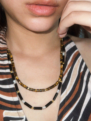 wearing Handmade Black Onyx Bead Necklace and Handmade Tiger's Eye Bead Necklace