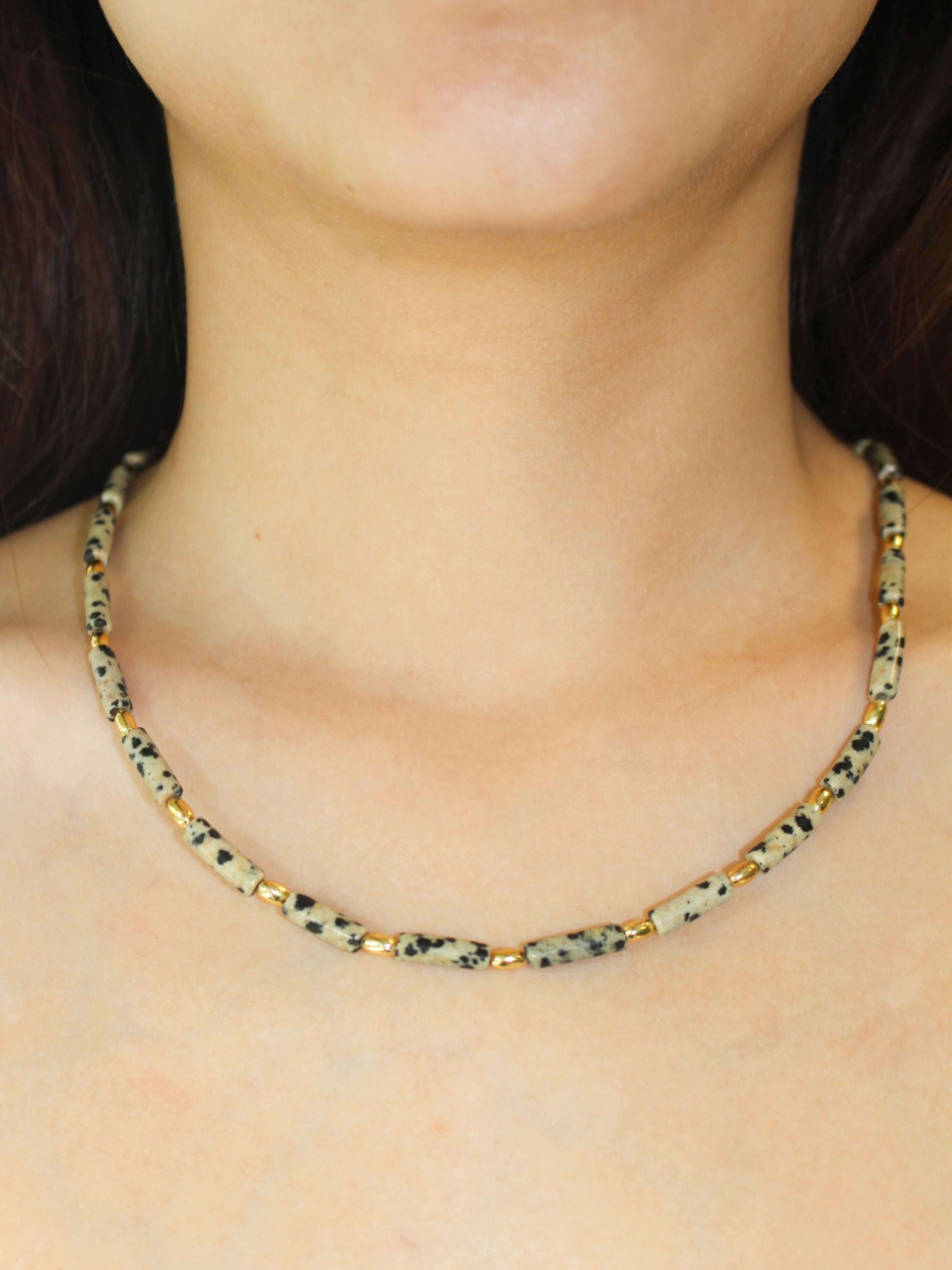 wearing Handmade Speckled Stone Bead Necklace