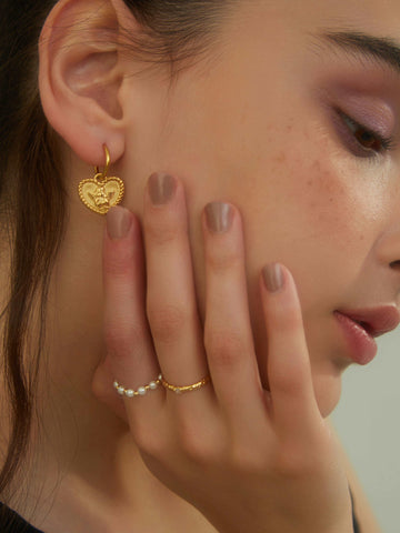 wearing Kayla Gold Hoops, pearl beaded ring and thin gold ring