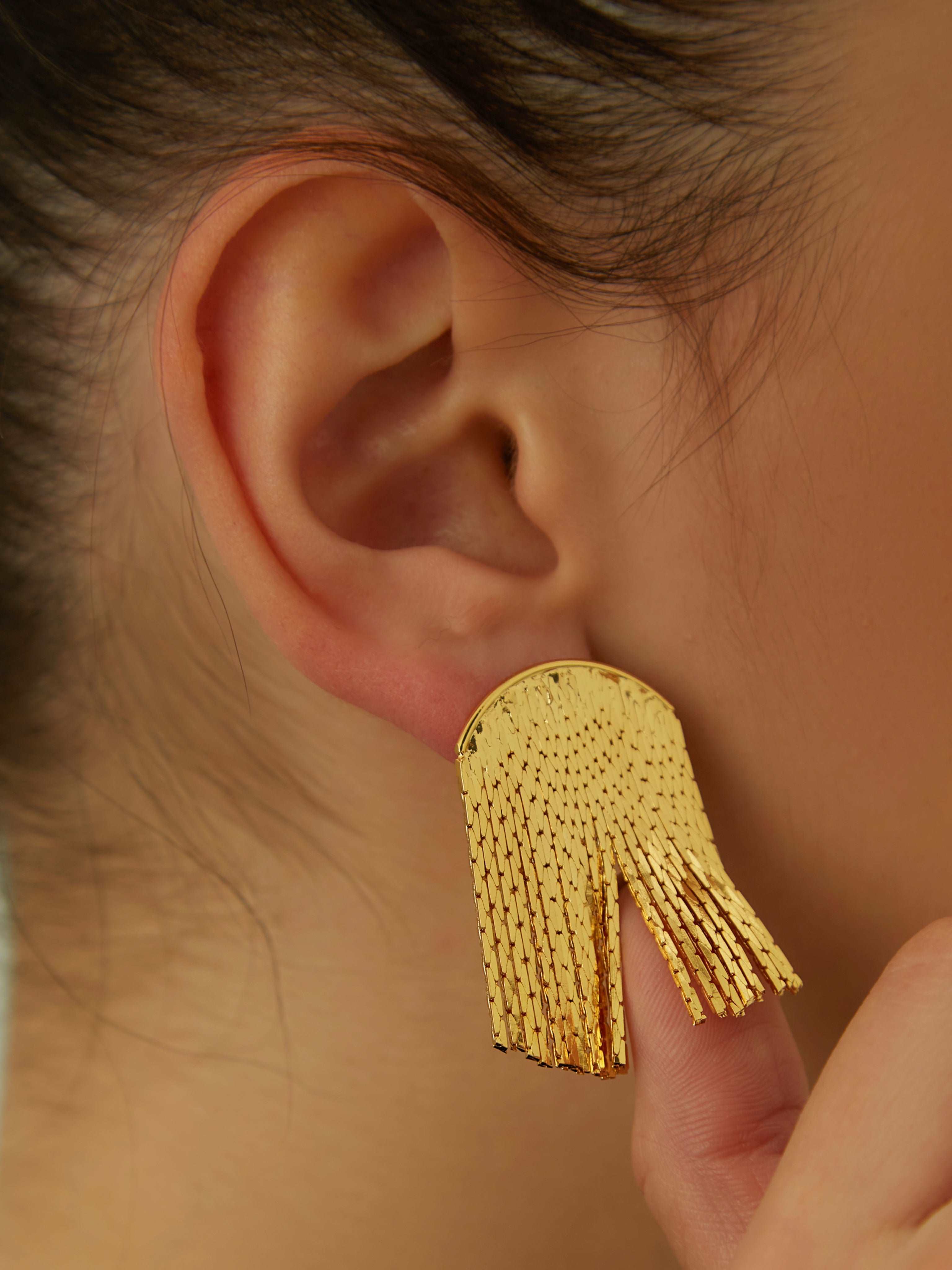 wearing gold Lucia Specular Surface Earrings