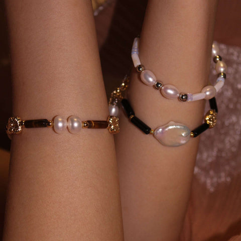 wearing Pinctada Beaded Bracelet, tiger's eye bracelet and black onyx bead bracelet