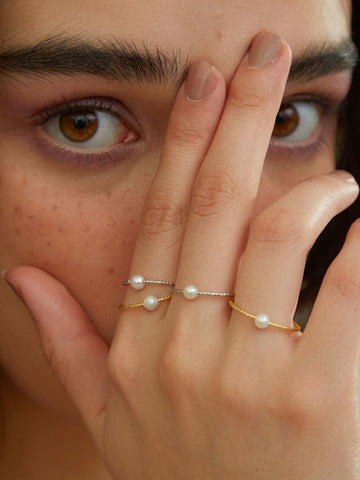 wearing gold and silver Single Pearl Ring