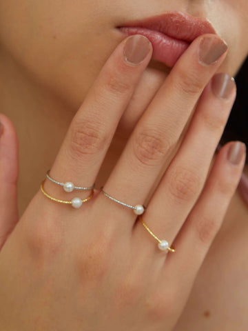 wearing gold and silver Single Pearl Rings